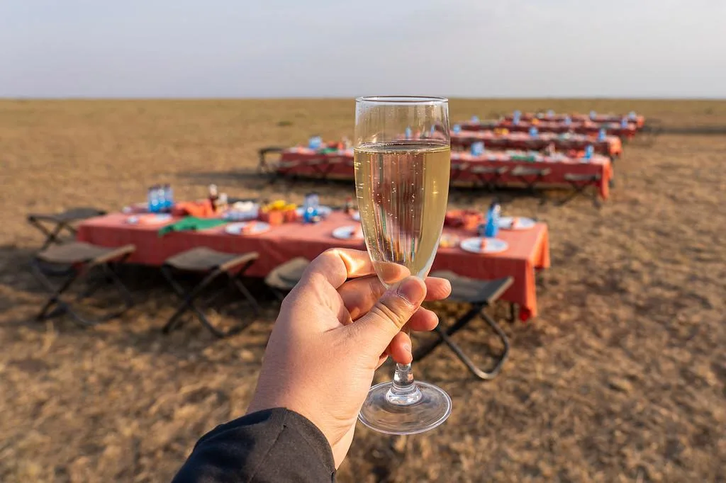 Champagne bush breakfast in maasai mara kenya after hot air balloon safari